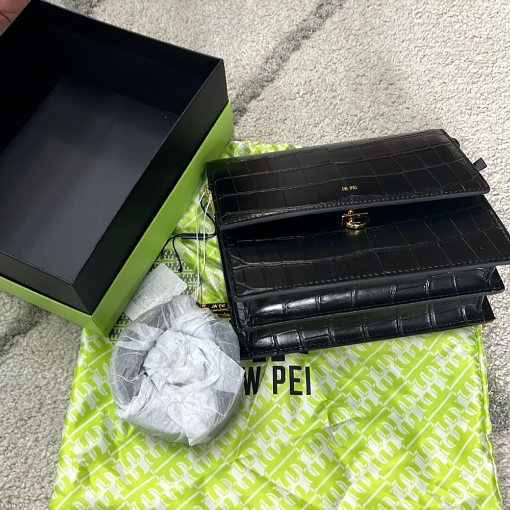 JW PEI Mini Flap Crossbody dressed in croc-embossed vegan leather